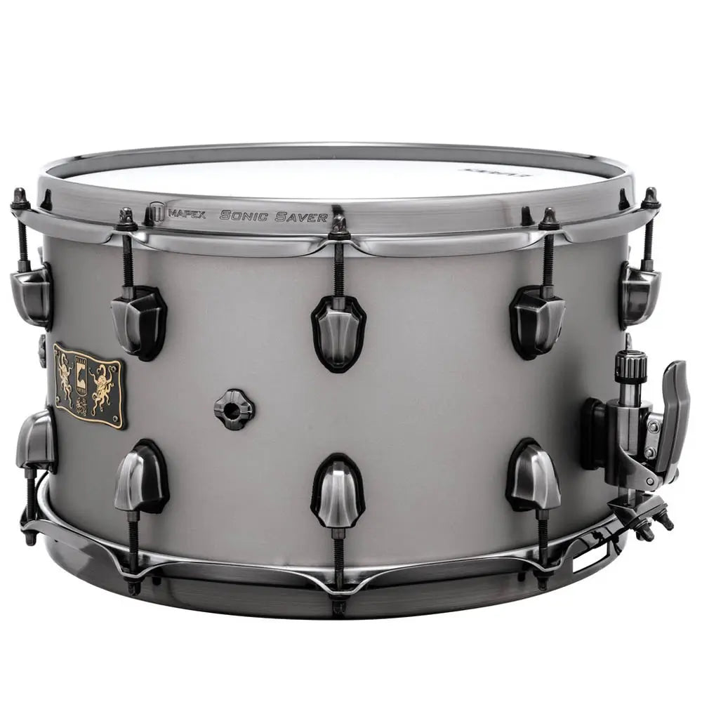 Snare drum with a white finish and black hardware on a white background