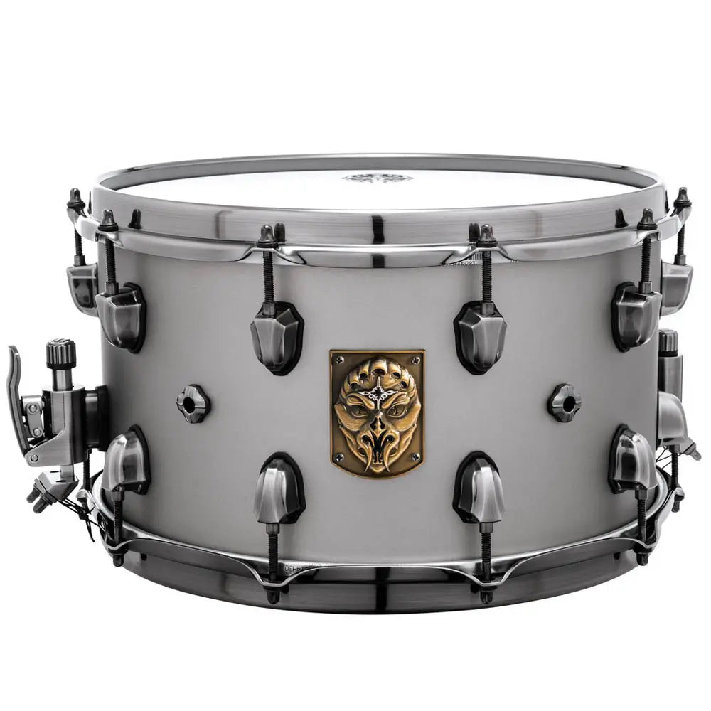 Snare drum with a decorative emblem on a white background