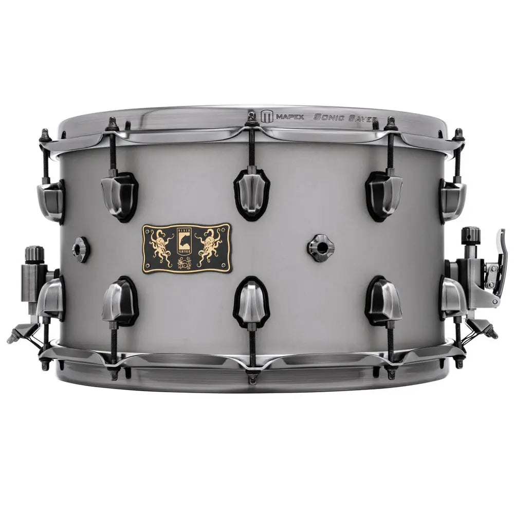 Snare drum with a metallic finish on a white background